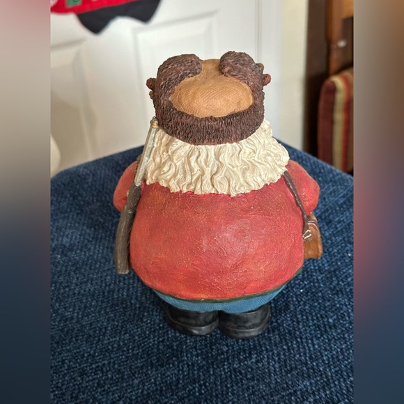 Hunting Santa carries his binoculars and hunting equipment wearing a furry hat - Picture 4 of 8